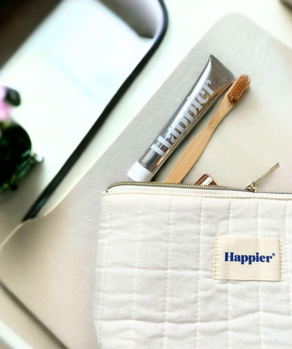 Washbag with toothbrush and toothpaste, including Happier Fresh Mint Toothpaste Travel Size 20ml.