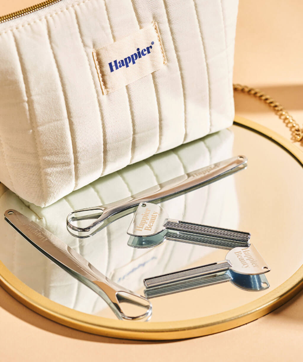 Happier  Beauty essentials: washbag,tongue cleaner,and squeeze key.