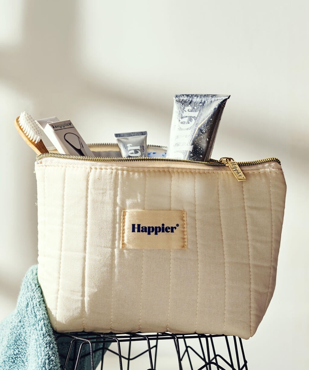 Washbag containing all the Happier essential products.